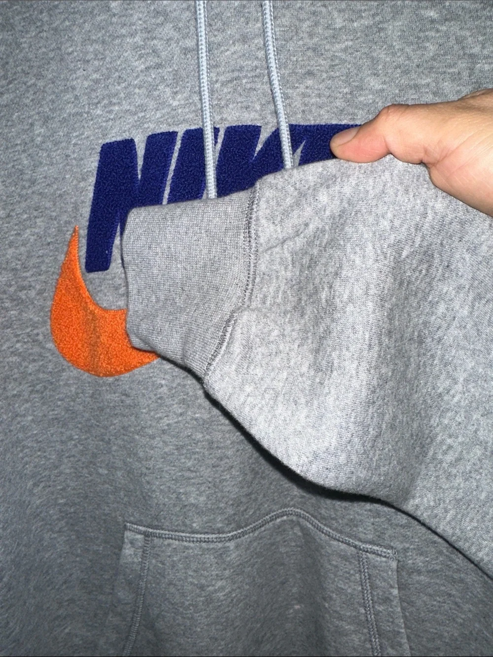 Nike Gray Hoodie with Blue Logo and Orange Swoosh Accent